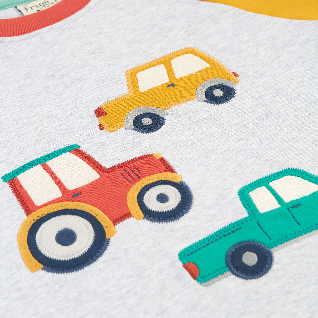 Long-sleeved raglan t-shirt- vehicles appliqué